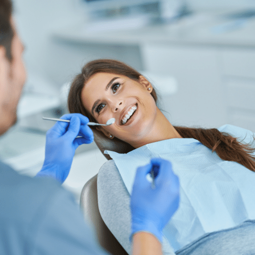 a woman smiling during a dental exam